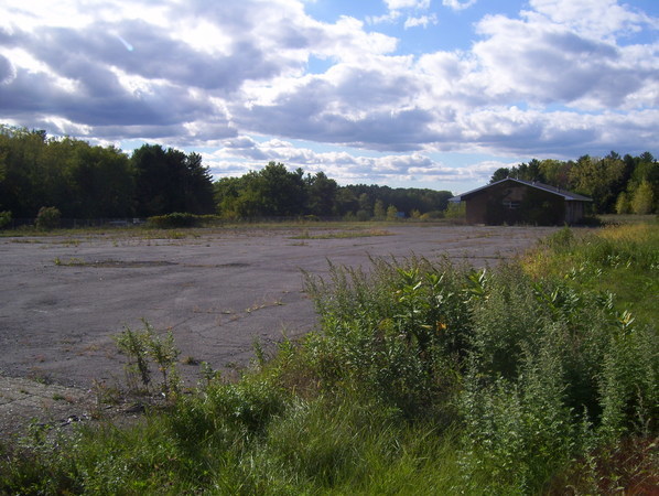 Abandoned service area gas station building and parking